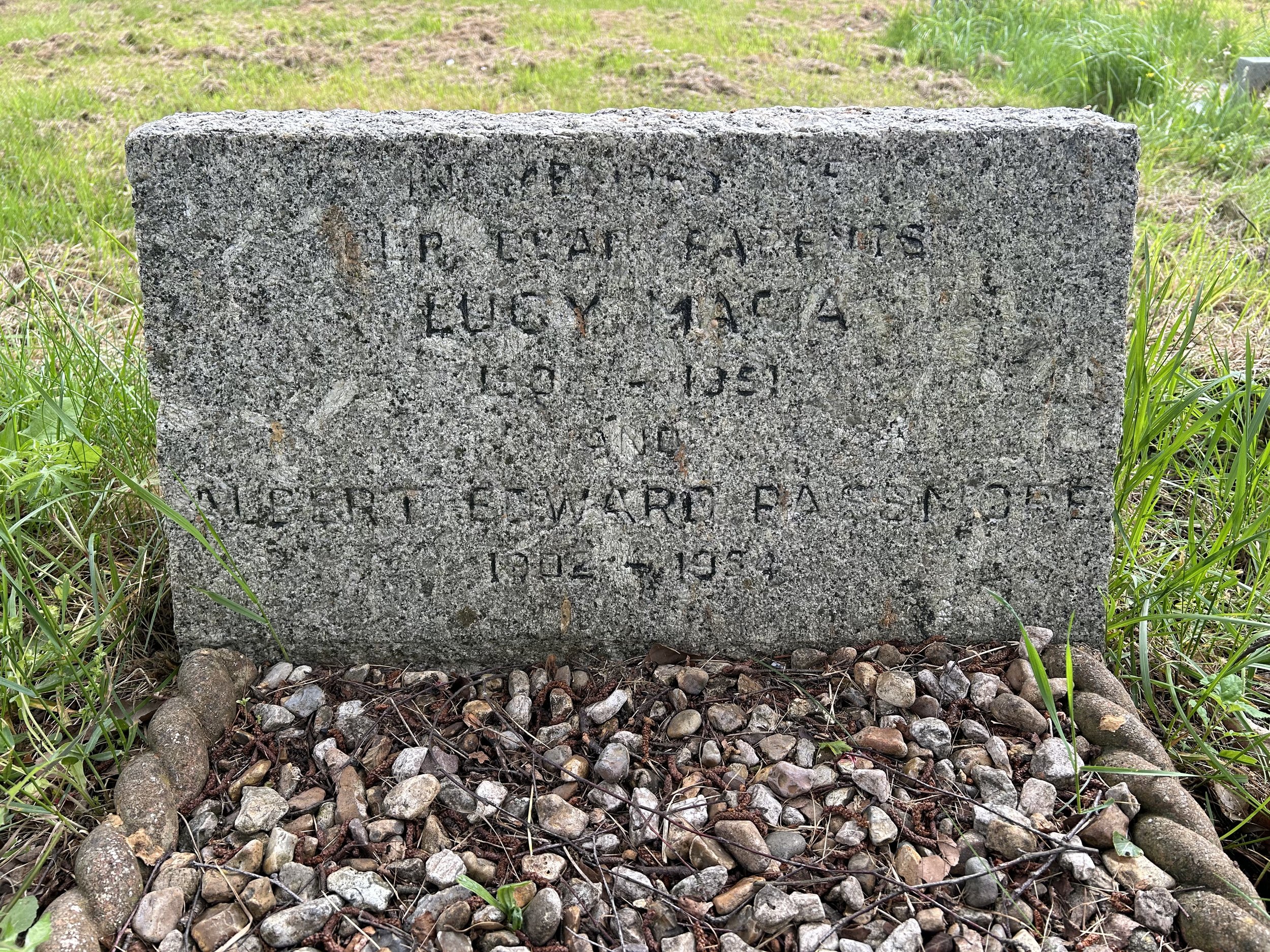 before shot of weathered lettering on headstone