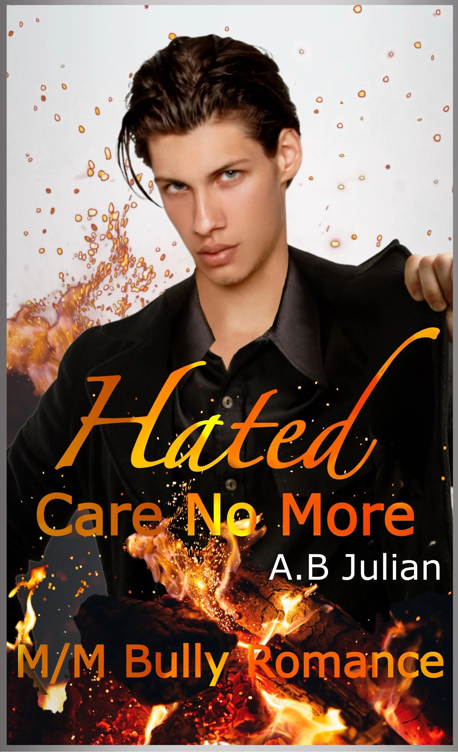 A young man with dark hair, wearing a black shirt, appears to be holding a fiery, glowing object or representing fire in a dramatic pose against a gray background with orange and red splashes. The cover features the title 'Hated Care No More' by A.B Julian with the subtitle 'M/M Bully Romance' in orange text.
