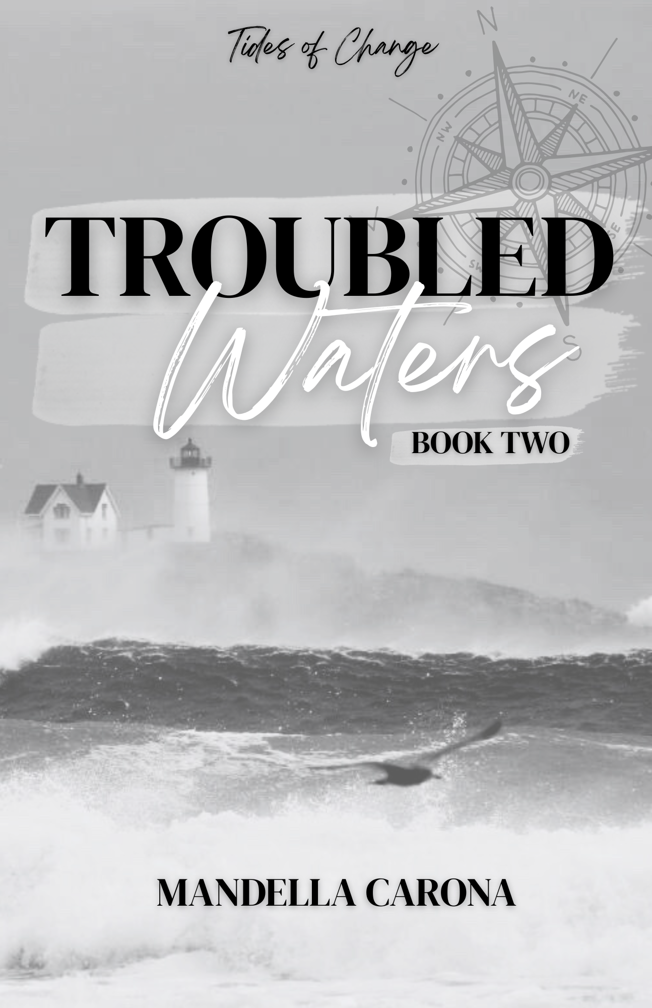 Book cover for 'Troubled Waters' by Mandella Carona, featuring a black and white image of a lighthouse, lighthouse house, and ocean waves with a compass design in the background.