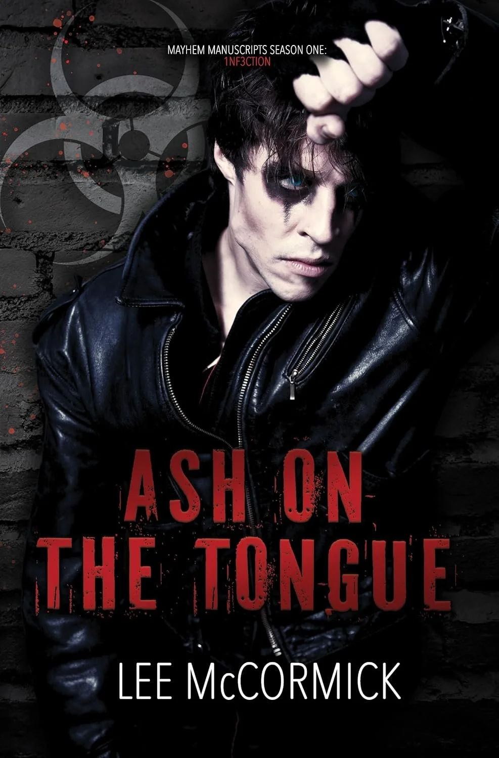 Book cover of 'Ash on the Tongue' by Lee McCormick featuring a person with pale skin, black makeup around eyes, and distressed hairstyle, wearing a black leather jacket, against a dark brick wall with biohazard symbols and red paint splatters.