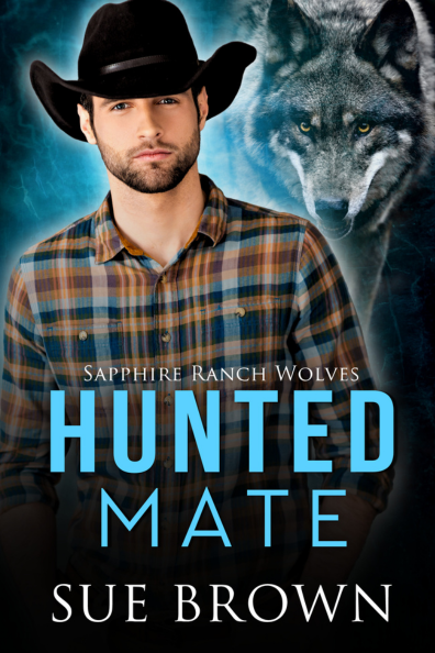 Cover of the book titled 'Hunted Mate' by Sue Brown, featuring a young man wearing a black cowboy hat and plaid shirt, with a large wolf in the background.
