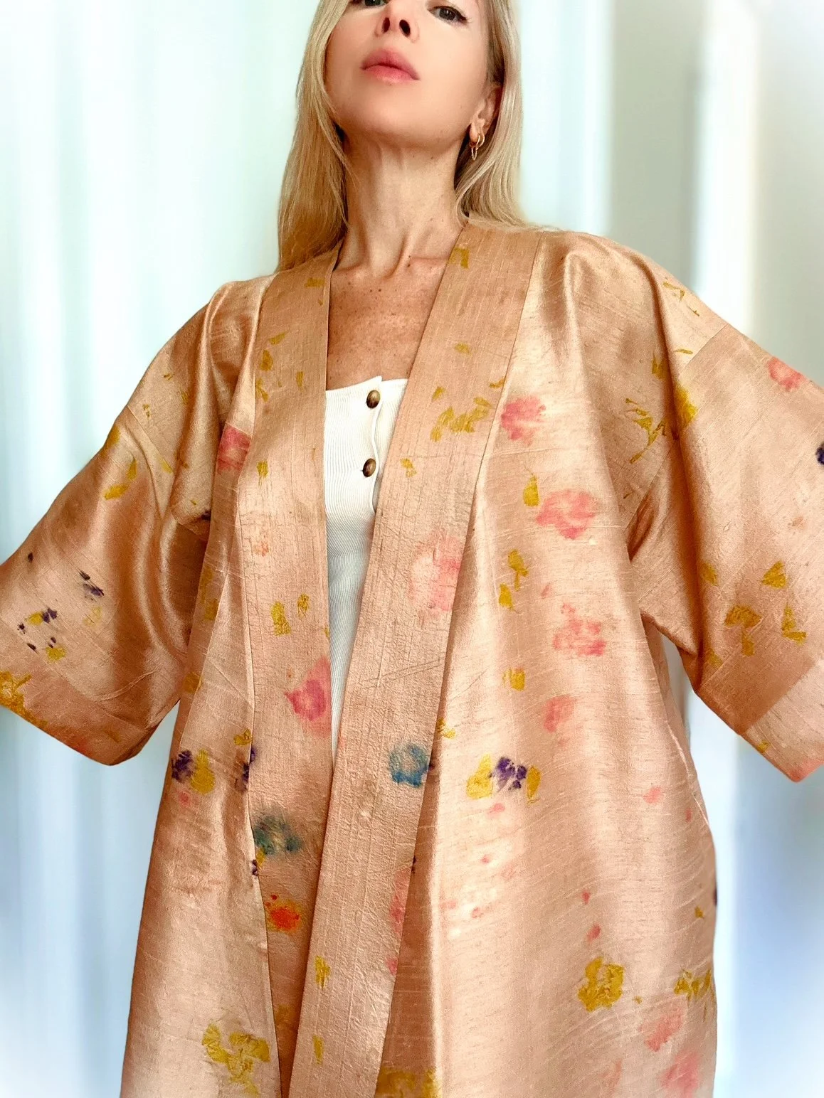 Handmade raw silk robe eco-printed with marigolds, impatiens, begonias, and butterfly pea flowers. One-of-a-kind botanical wearable art with wide sleeves and a flowing silhouette.