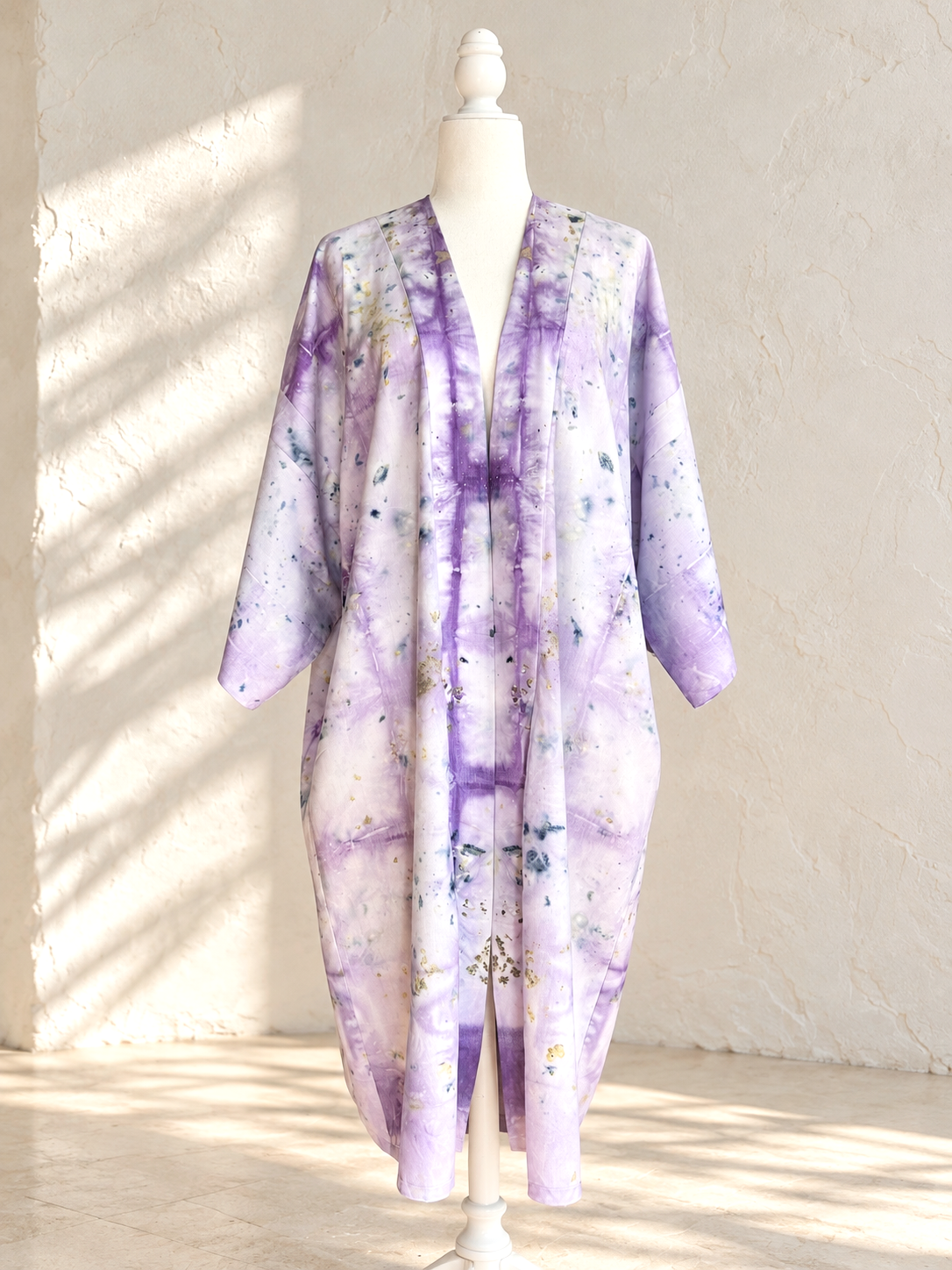 One-of-a-kind long silk duster by Flora Obscura, shibori-dyed with logwood and botanically contact printed with butterfly pea flowers and roses.