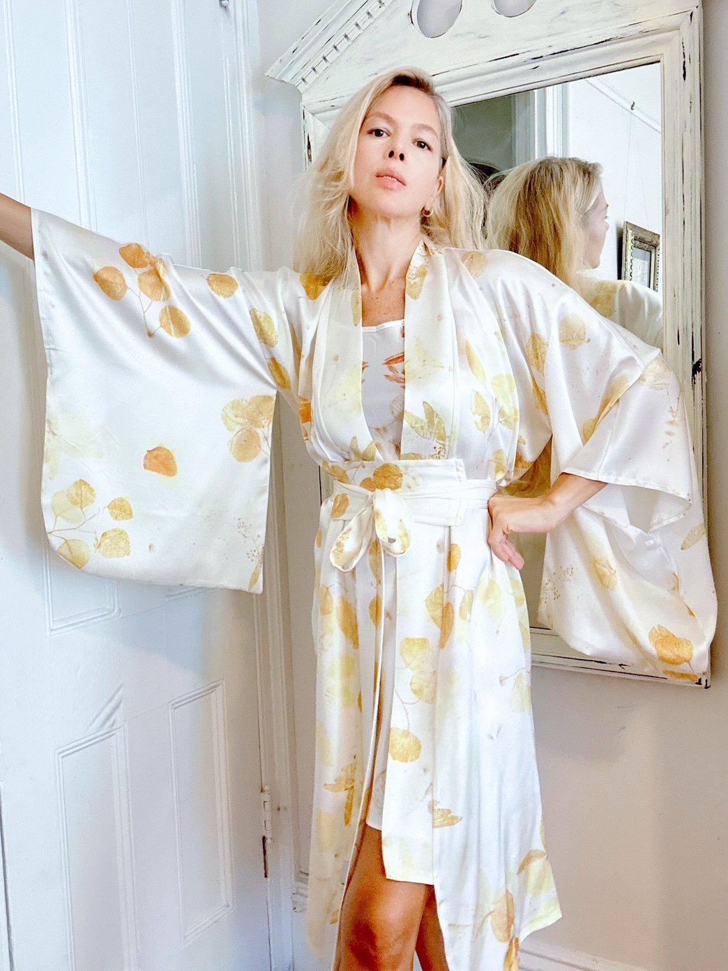 Luxe silk charmeuse robe botanically printed in soft cream and gold. Hand eco dyed, one-of-a-kind, and sustainably crafted for elegant loungewear or bridal wear.