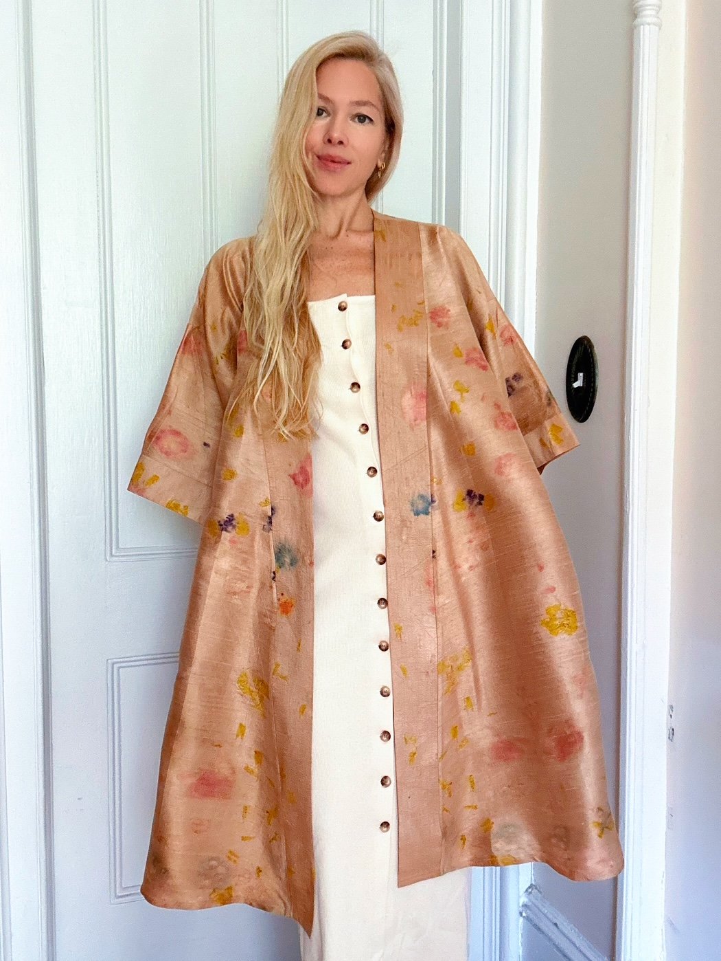 Handmade raw silk robe eco-printed with marigolds, impatiens, begonias, and butterfly pea flowers. One-of-a-kind botanical wearable art with wide sleeves and a flowing silhouette.