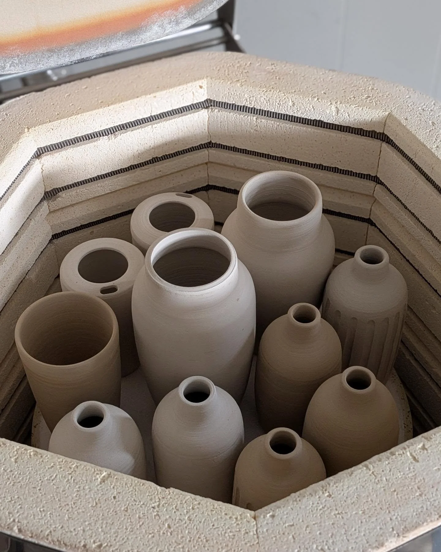 Swipe to fire a bisque kiln. 🔥

It doesn't look like much, but this is the necessary step for me to start glazing and fire #1 of 2.

I've been waiting through lightning storms and heat advisories to run this, and my shelves are filling up!

#clay #c