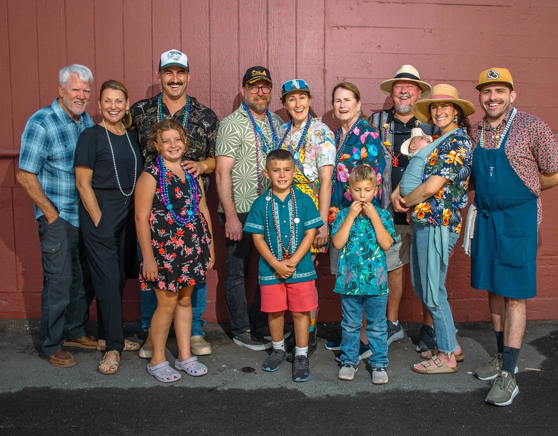 A group picture of Elise Landry and Adam Wagner surrounded by their family.