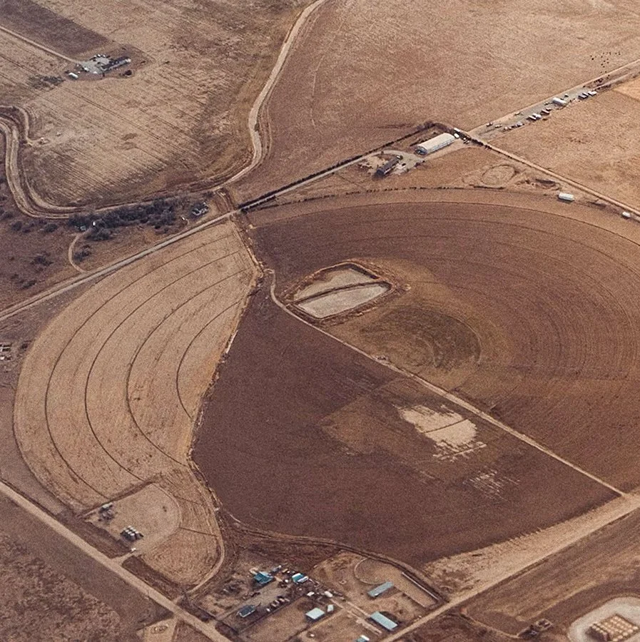 A drone photo showing dry, barren farmland.