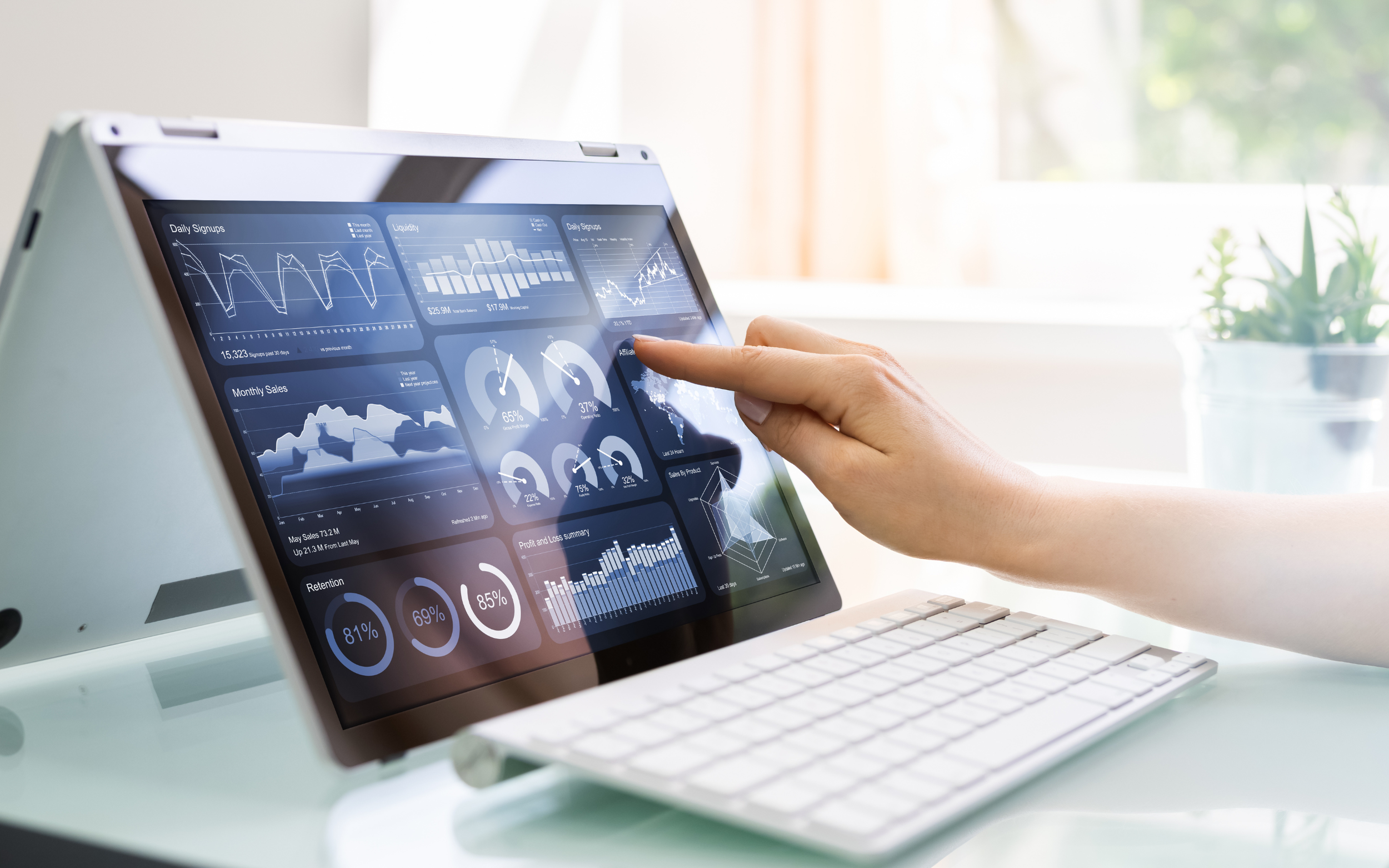 This photo shows a woman using a tablet to analyze data. She is looking at graphs, charts, and other analytics to make informed decisions. With the help of technology, she can gain valuable insights that will lead her to success!