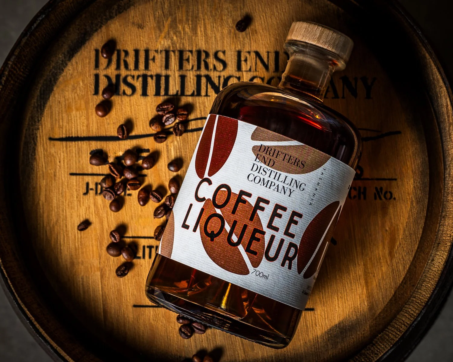 Coffee Liqueuer on Barrel with coffee Beans