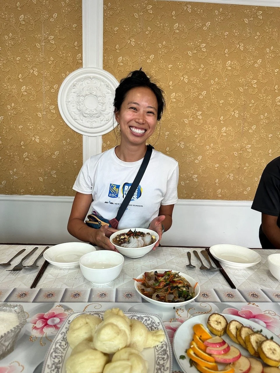  Proudly holding my bowl of ashlan-fu.     When I first tasted this dish in the market (next photo) I thought it tasted very similar to the Chinese dish 凉粉 (liang fen) which is made from mung bean noodles. It turns out that the Dungan people had brou