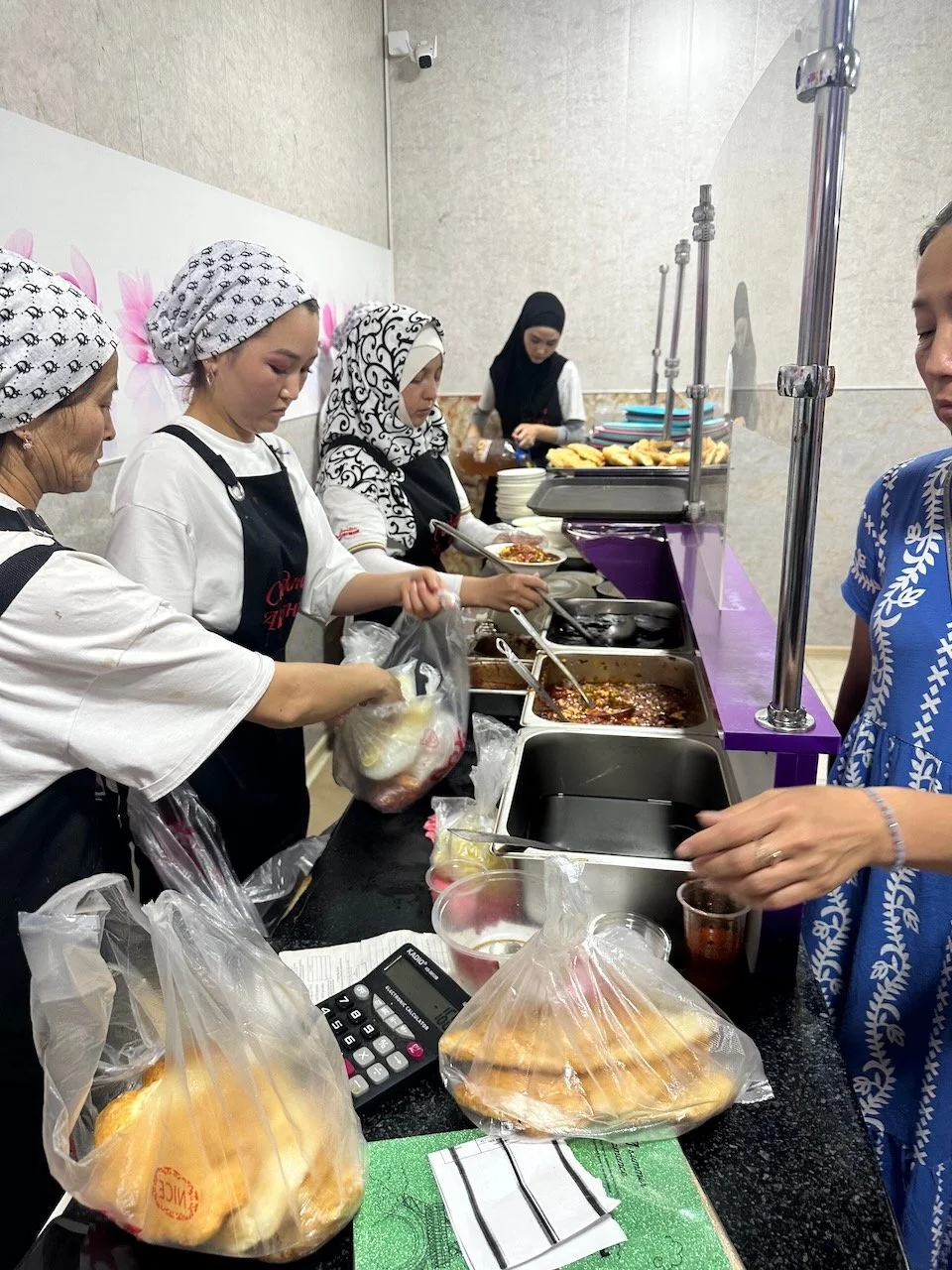  My first experience with ashlan-fu at Ashlan-Fu Alley, an alley where several vendors serve ashlan-fu. This was the most popular one and where all the locals went, so of course I stopped here.     You can see the assembly line of how they prepare as
