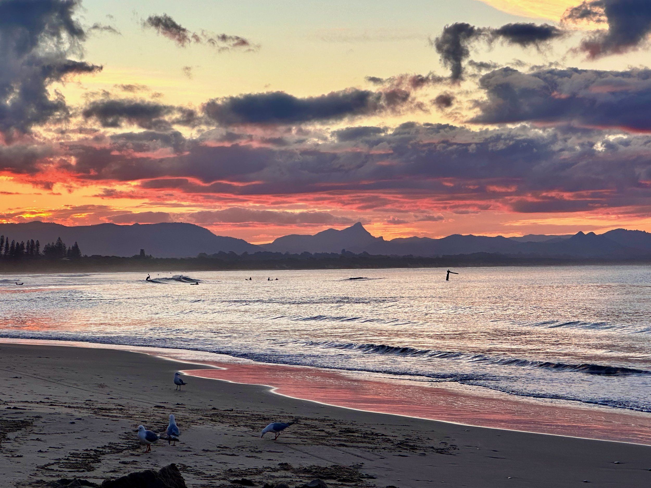  Right after sunset — you can see the transition of the sky from above (golden hour) to here (blue hour, although it’s vivid oranges here). 