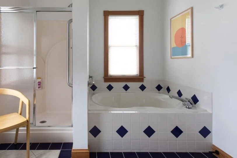 Jetted tub in top level bathroom