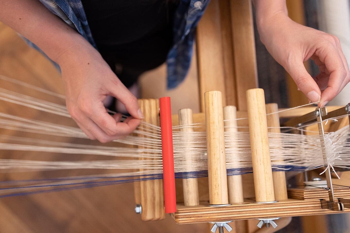Thread by thread &bull; The last step between the spools and the beam is the tensionbox. With this little handy tool all the threads stay nicely sorted and under proper tension. Like that everything goes onto the loom neatly to start weaving. Using a