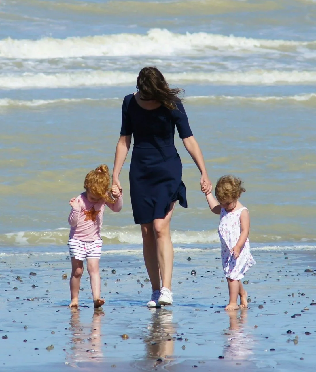 Mom and two kids at beach