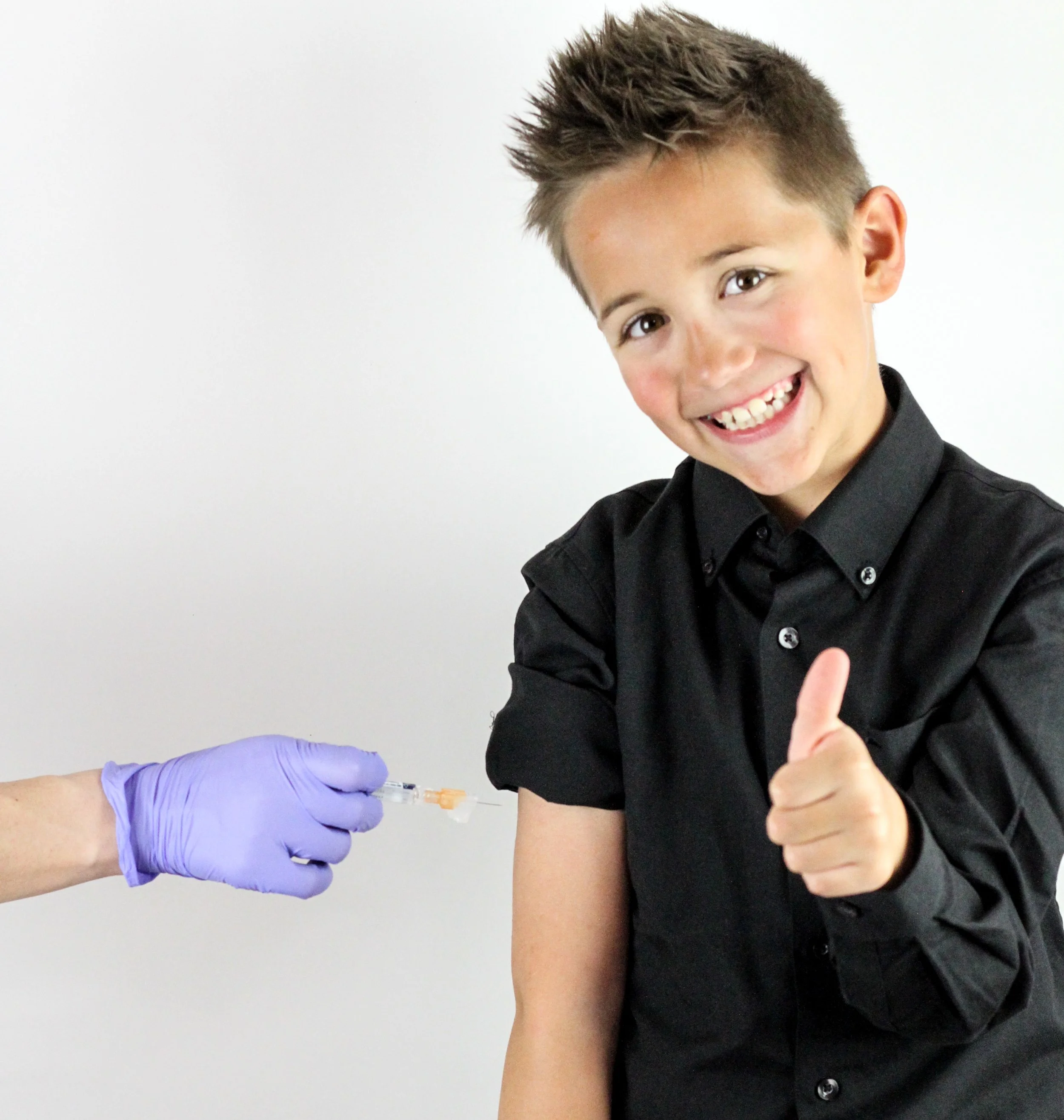 A healthcare professional administering a vaccine or injection to a male patient in a clinical setting.