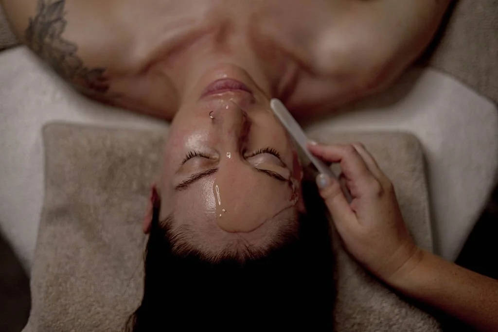 a woman receiving a facial mask; co2lift pro
