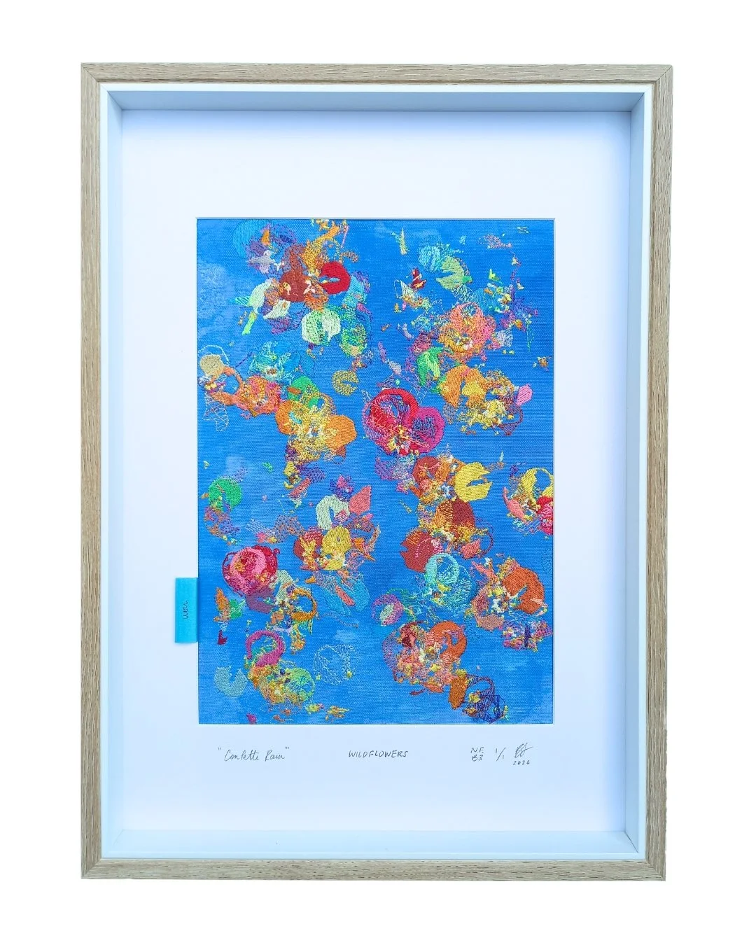 “Confetti Rain” -
 WILDFLOWERS -
 not forgotten series / bloom three. 2026.
Acrylic paint, cotton & polyester embroidery on cotton.
 Glass framed - 450 mm x 330 mm.
 Edition 1/1.
 $450.