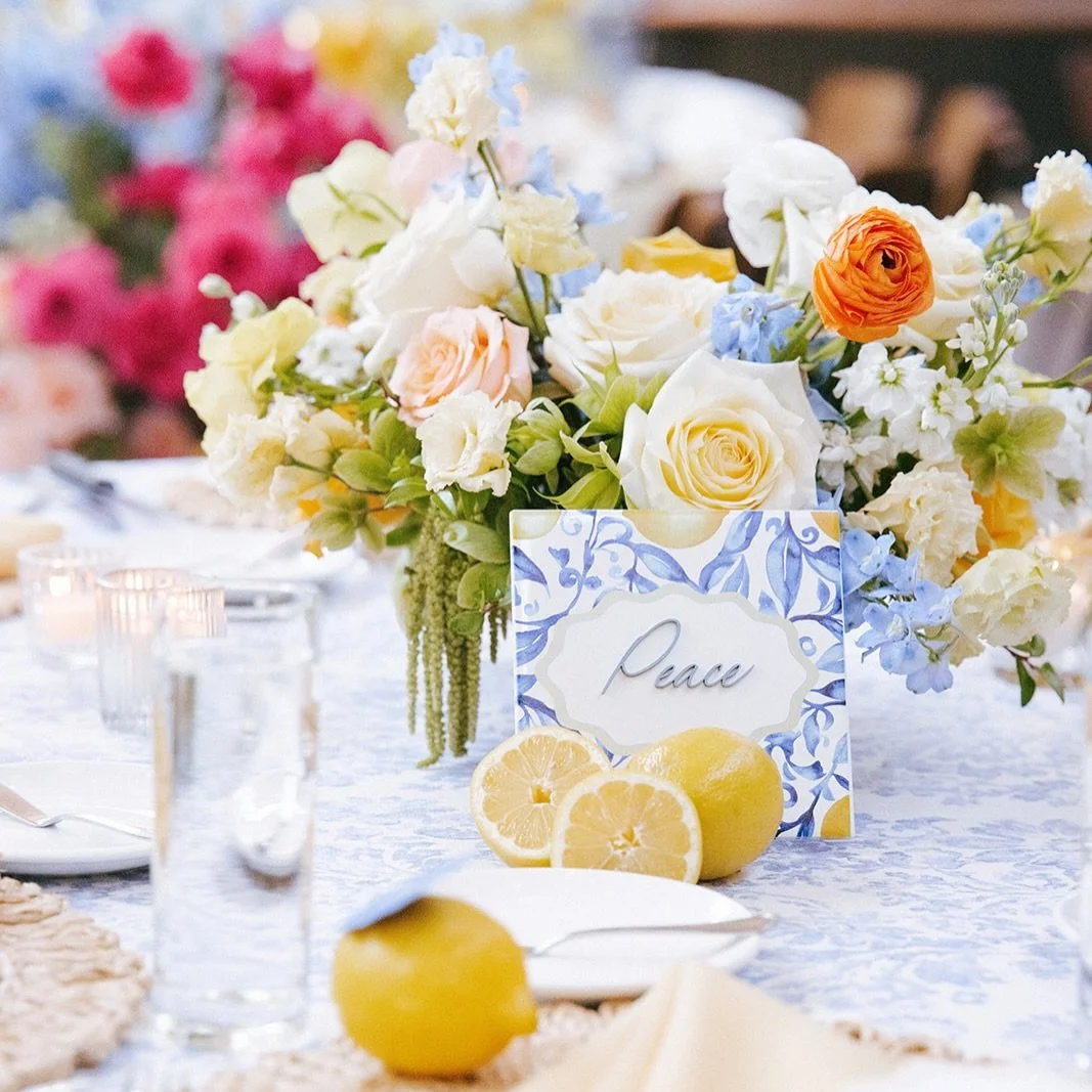 Every detail was thoughtfully layered to tell a story.

Shades of blue, buttery yellow, and creamy ivory danced across the guest tables through textured linens, fresh citrus, and lush garden blooms, creating a setting that felt effortlessly elegant a