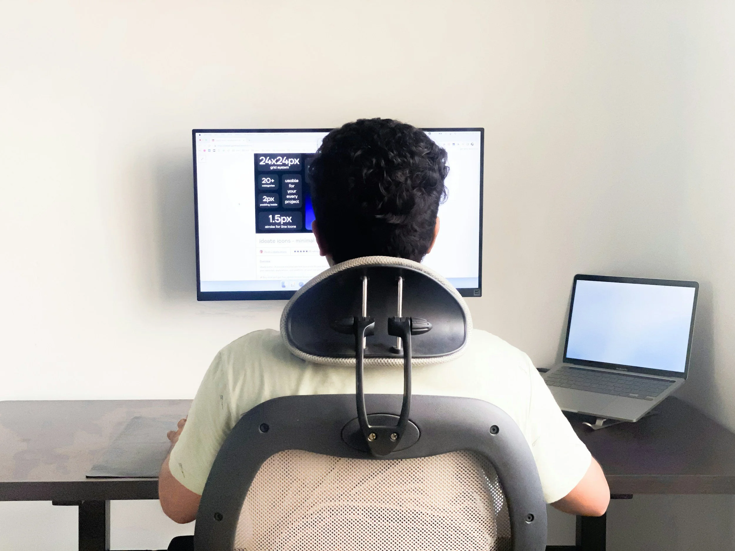 Person sitting at a desk with forward head posture, a common tech neck cause of cervicogenic headaches