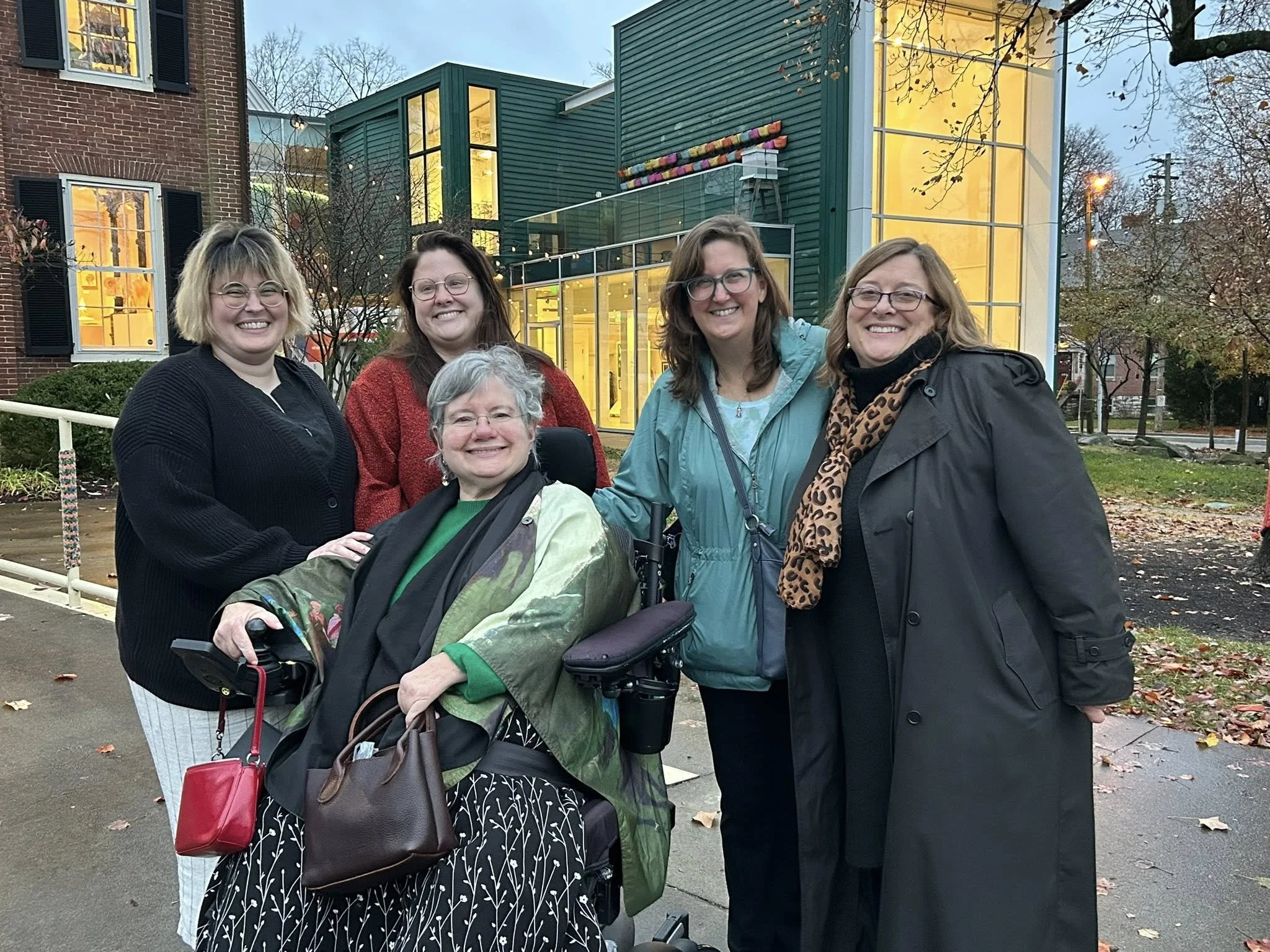 Several office members celebrating Angela's artistic talents!