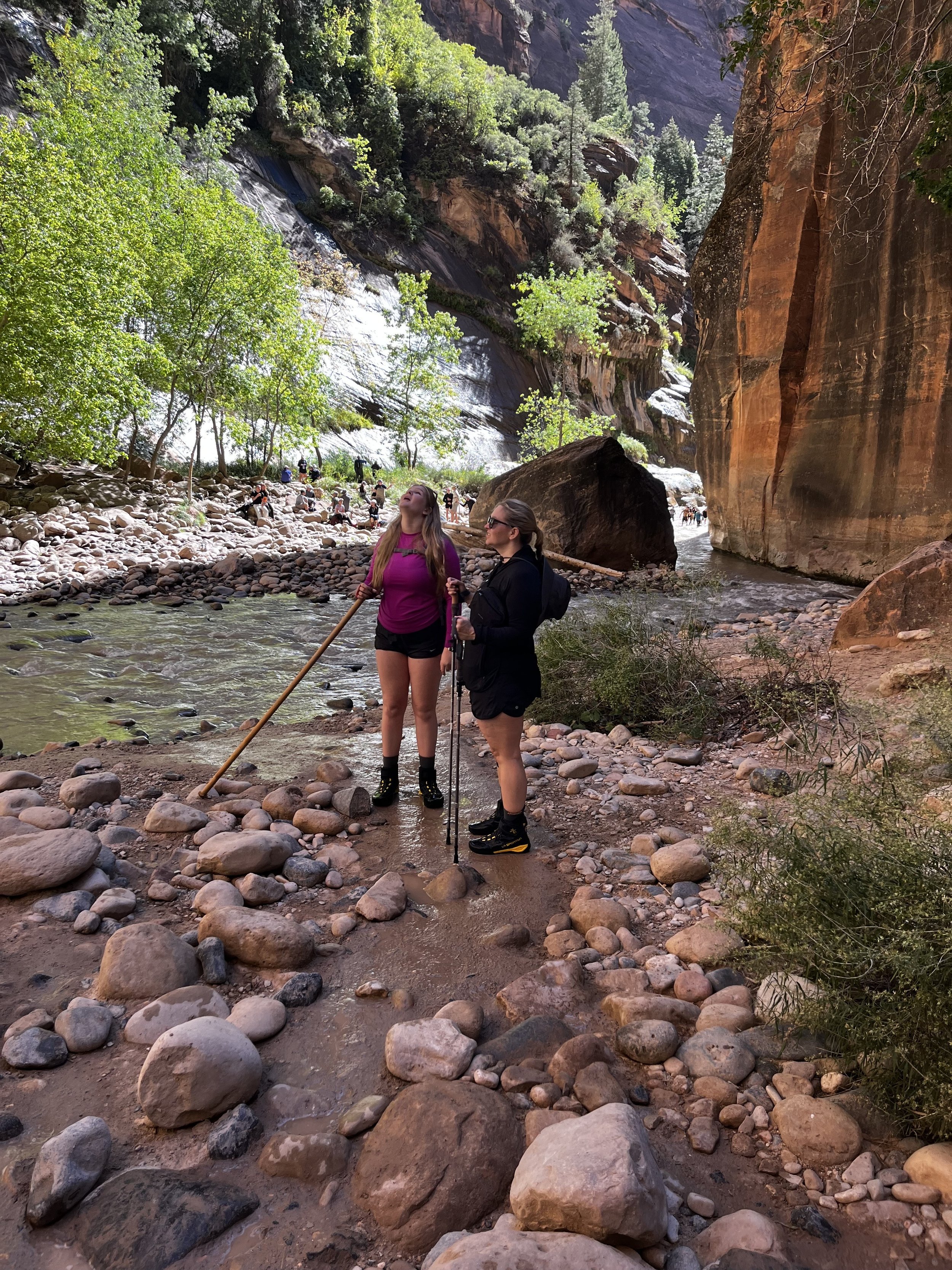 Mary and daughter hike the Narrows in Zion, Utah