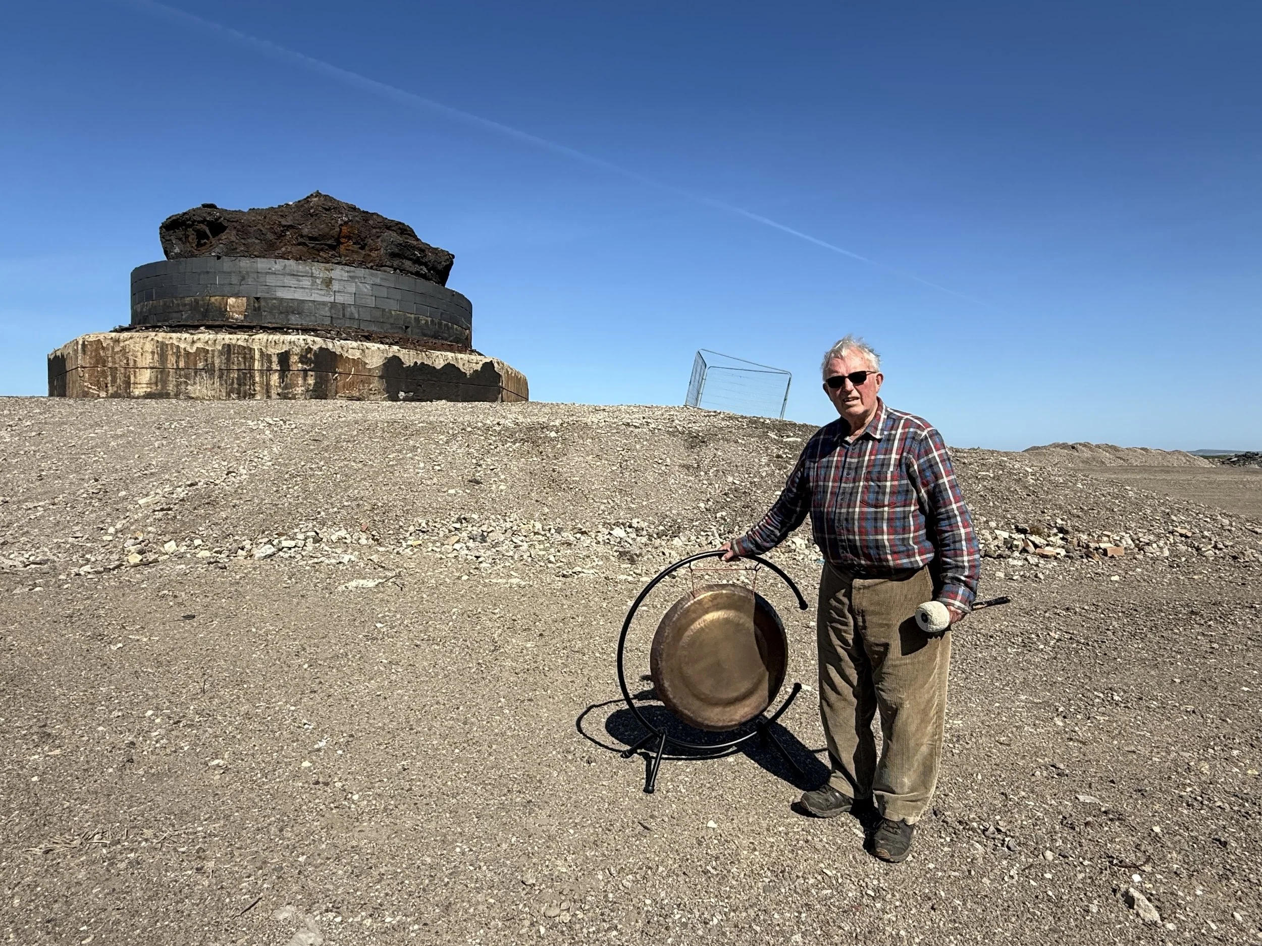 Peat in front of the remains of the Blast Furnace where he once worked.