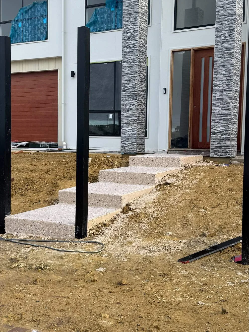 Aggregate concrete steps in Huntfield Heights house