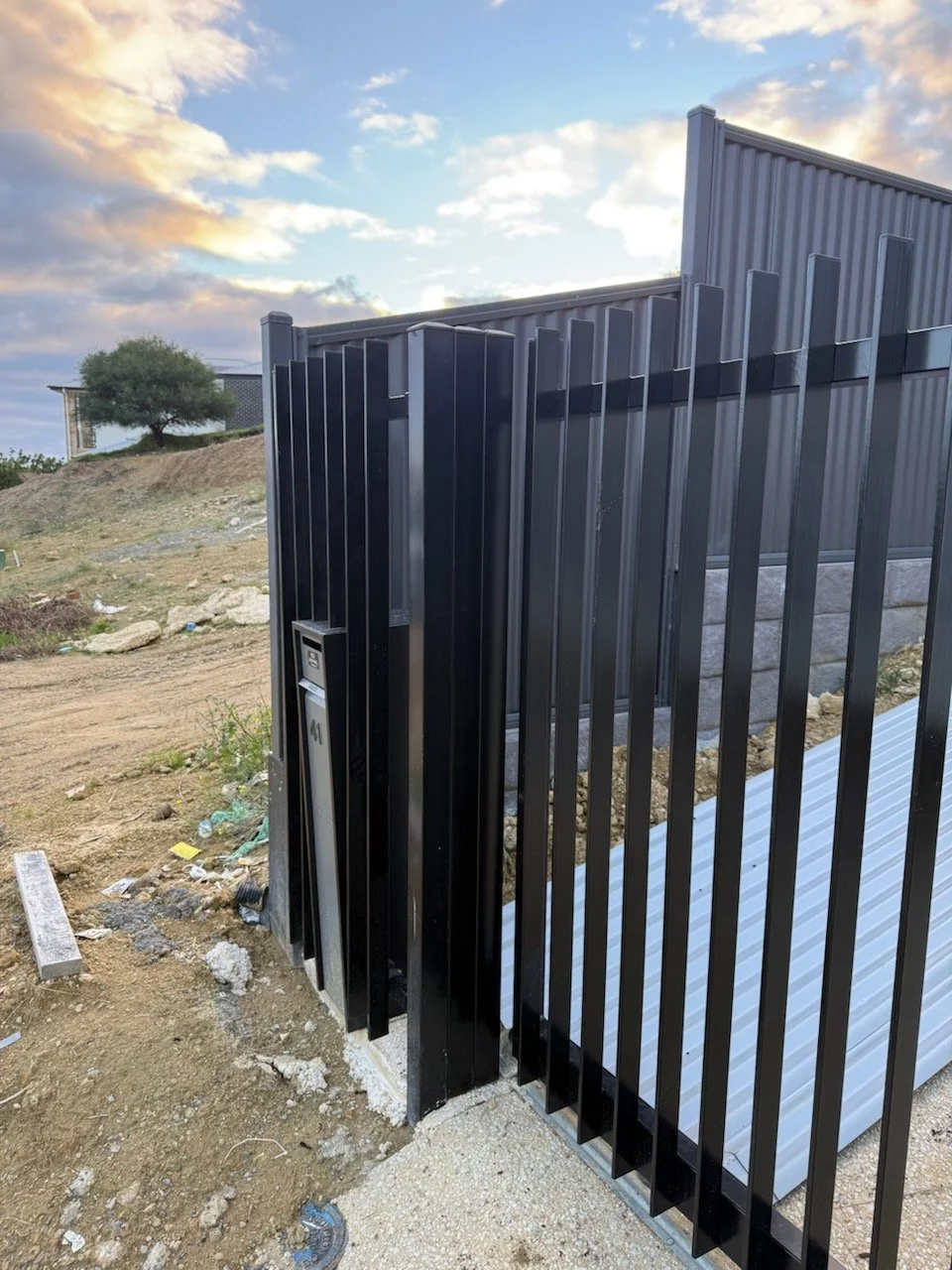 Vertical blades black color with 24v sliding gate plus pedestrian gate and letter box in Huntfield Heights