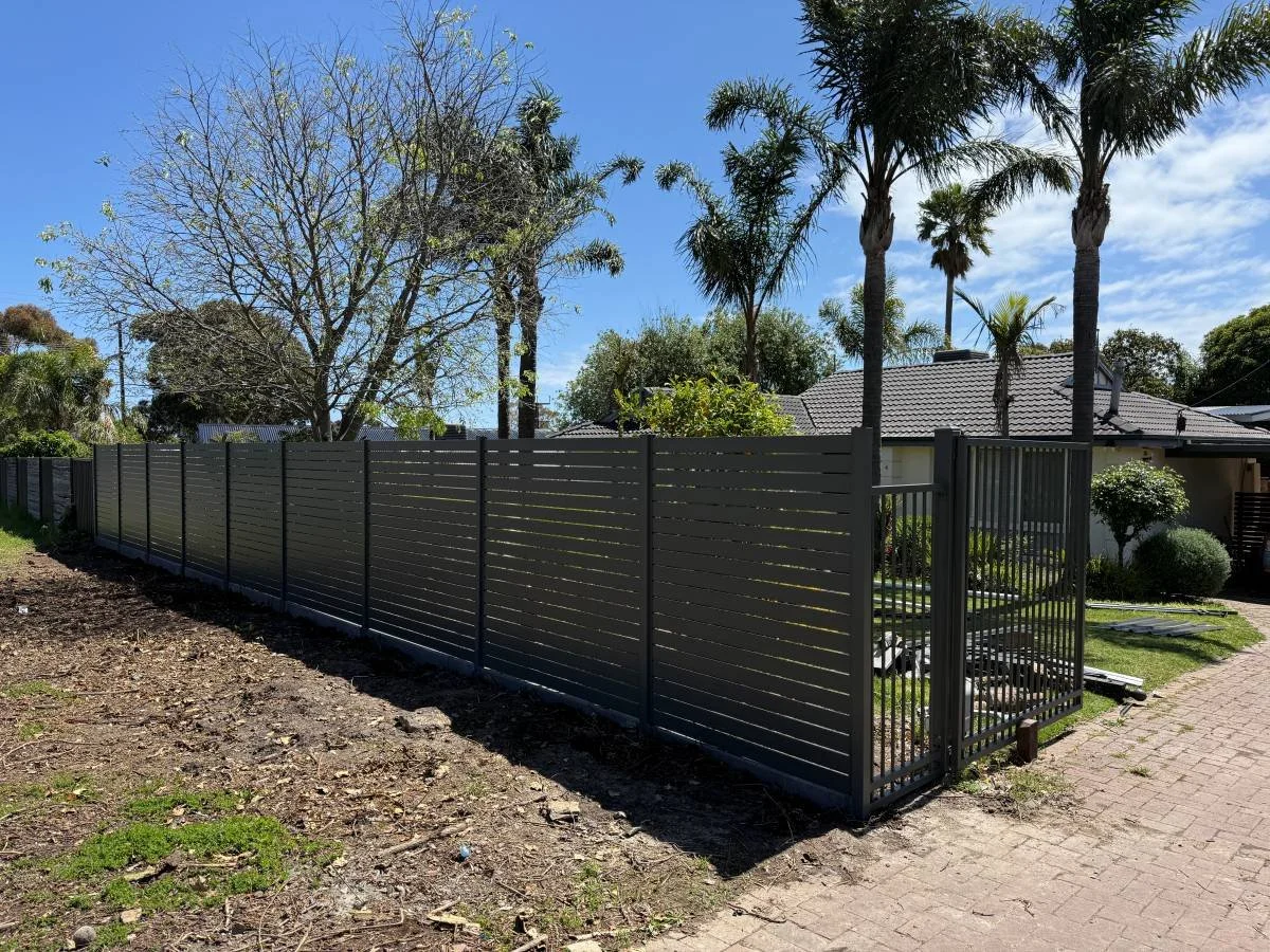 slat fence and pedestrian gate