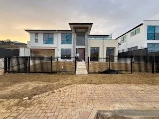 Vertical blades black color with 24v sliding gate plus pedestrian gate and letter box in Huntfield Heights