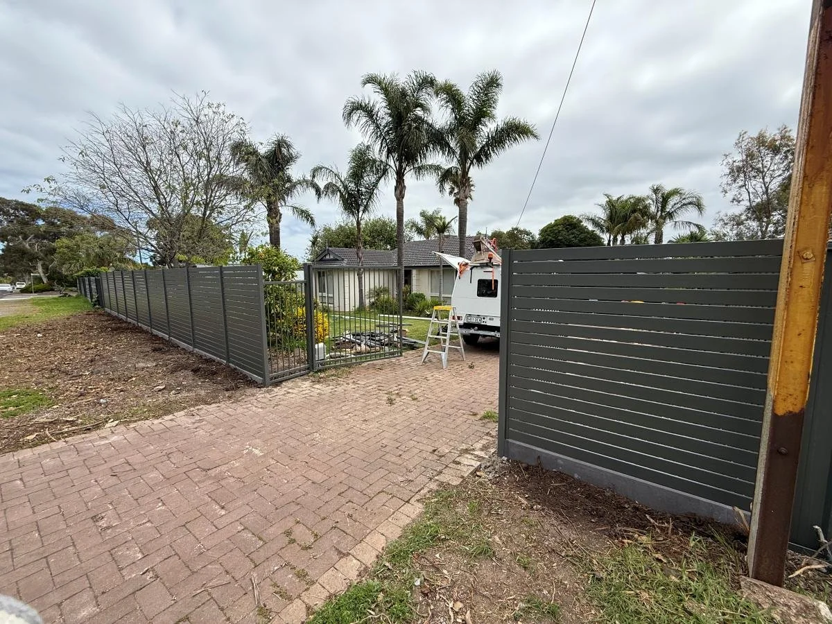 slat fence and pedestrian gate
