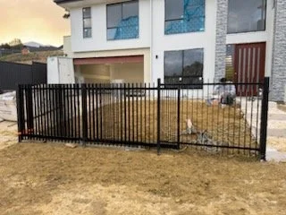 Vertical blades black color with 24v sliding gate plus pedestrian gate and letter box in Huntfield Heights