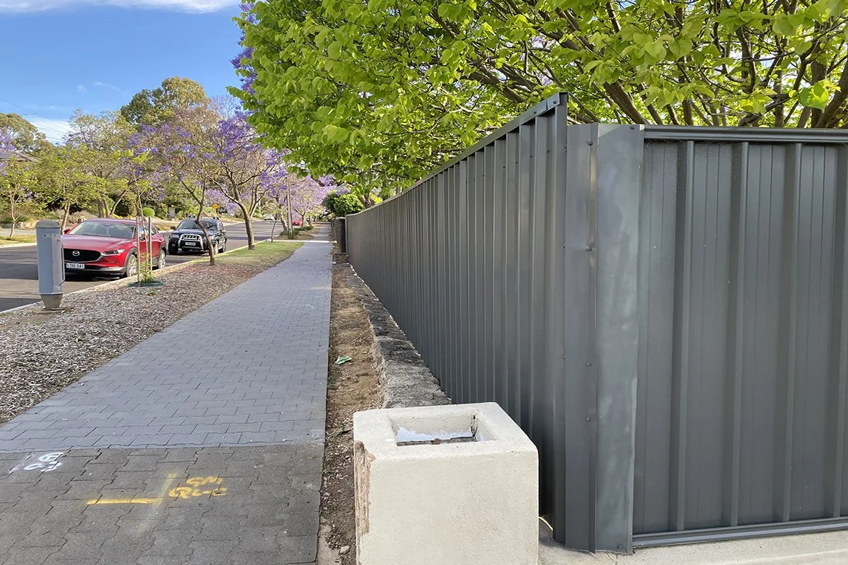 Grey fence and trees