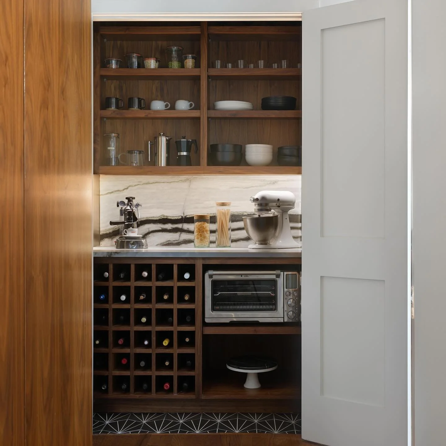 This bar/pantry storage is all about the walnut-and-marble magic. It&rsquo;s a stand-out piece for the kitchen adding rich and warm vibes.  Photography: @ny_lonestar  Styling: @__goldlion__