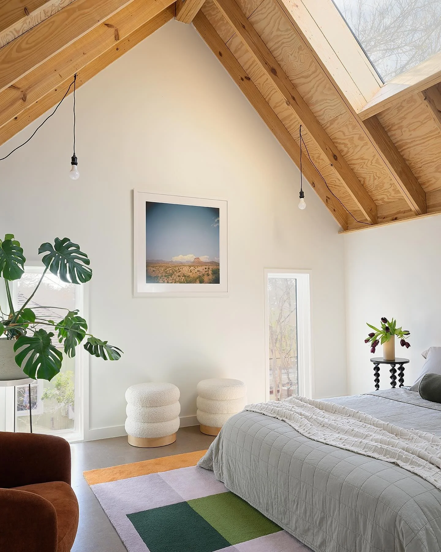 Here is a look inside the back of our Avenue H project. We needed to keep the roof plate low due to power line clearances.  So, we exposed the roof structure and directed your eyes upwards using big skylights.  We think it visually lifts the space.

