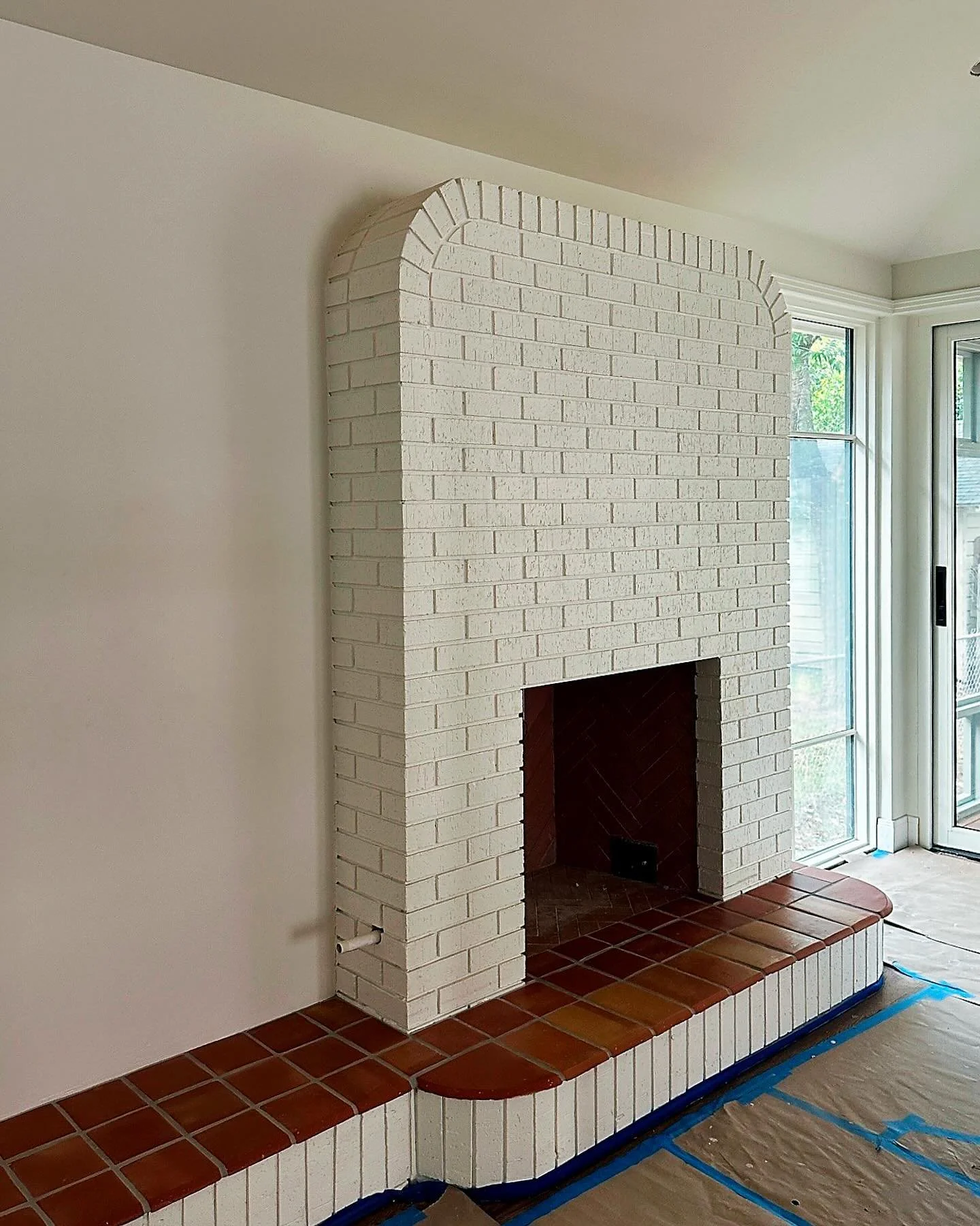 Glimpse of how this beautiful arched fireplace from our St. John&rsquo;s project is coming to life.Those are custom, semicircle saltillo tiles from @clayimports. Finishing touches are just around the corner! Swipe for progress shots.

#design
#archit