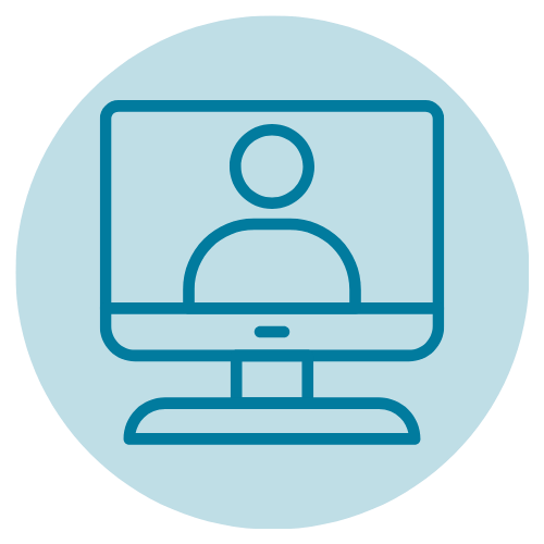 Close-up of a round, teal-colored logo with white text and a white underline. The text appears to say "AT&T" but is partially obscured.