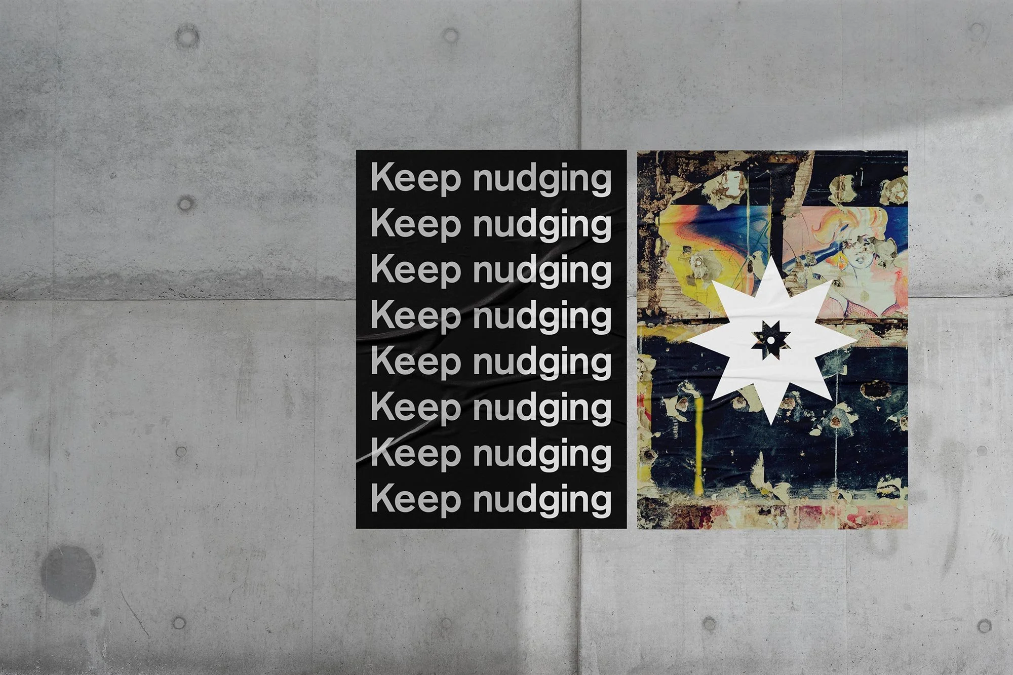 A concrete wall with two posters: one black with the repeated white text "Keep nudging" and the other featuring colorful abstract art with a large white star-shaped design in the center.