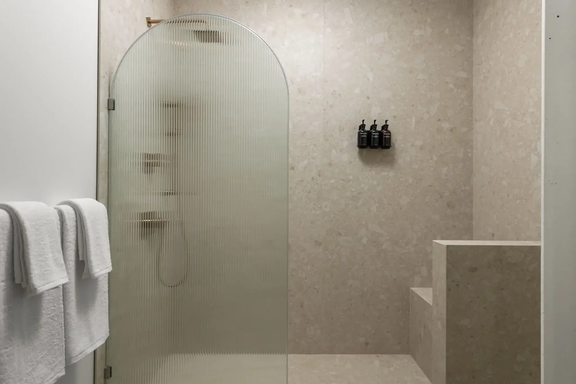 Stone bathroom with modern finishes in a guest room at The Skowhegan hotel