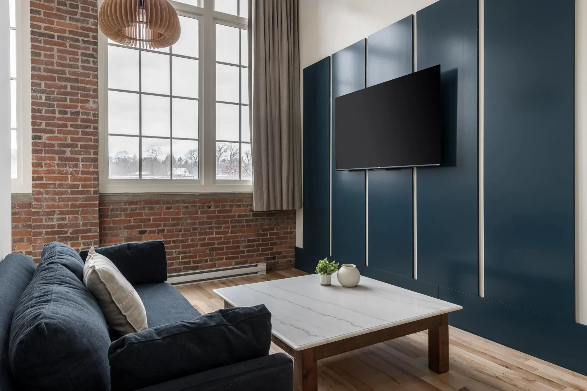 The Skowhegan hotel exterior and Kennebec River at dusk