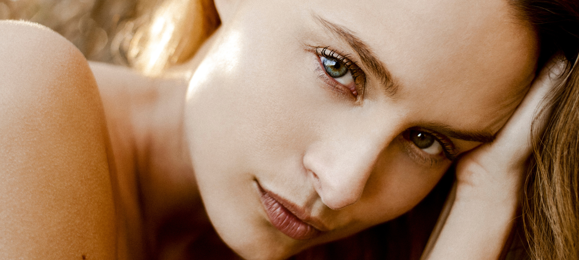 This beautiful photograph by Nathanael Filbert features a close-up shot of a model in the warmth of golden hour.