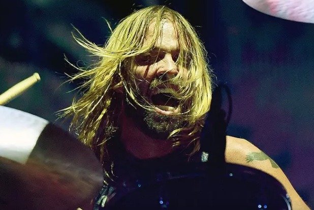 In a new interview with The Guardian, #FooFighters guitarists #PatSmear and #ChrisShiflett as well as bassist #NateMendel said #TaylorHawkins (who died in 2022) made such a seismic impact on the band that he's effectively still with them today

Get t
