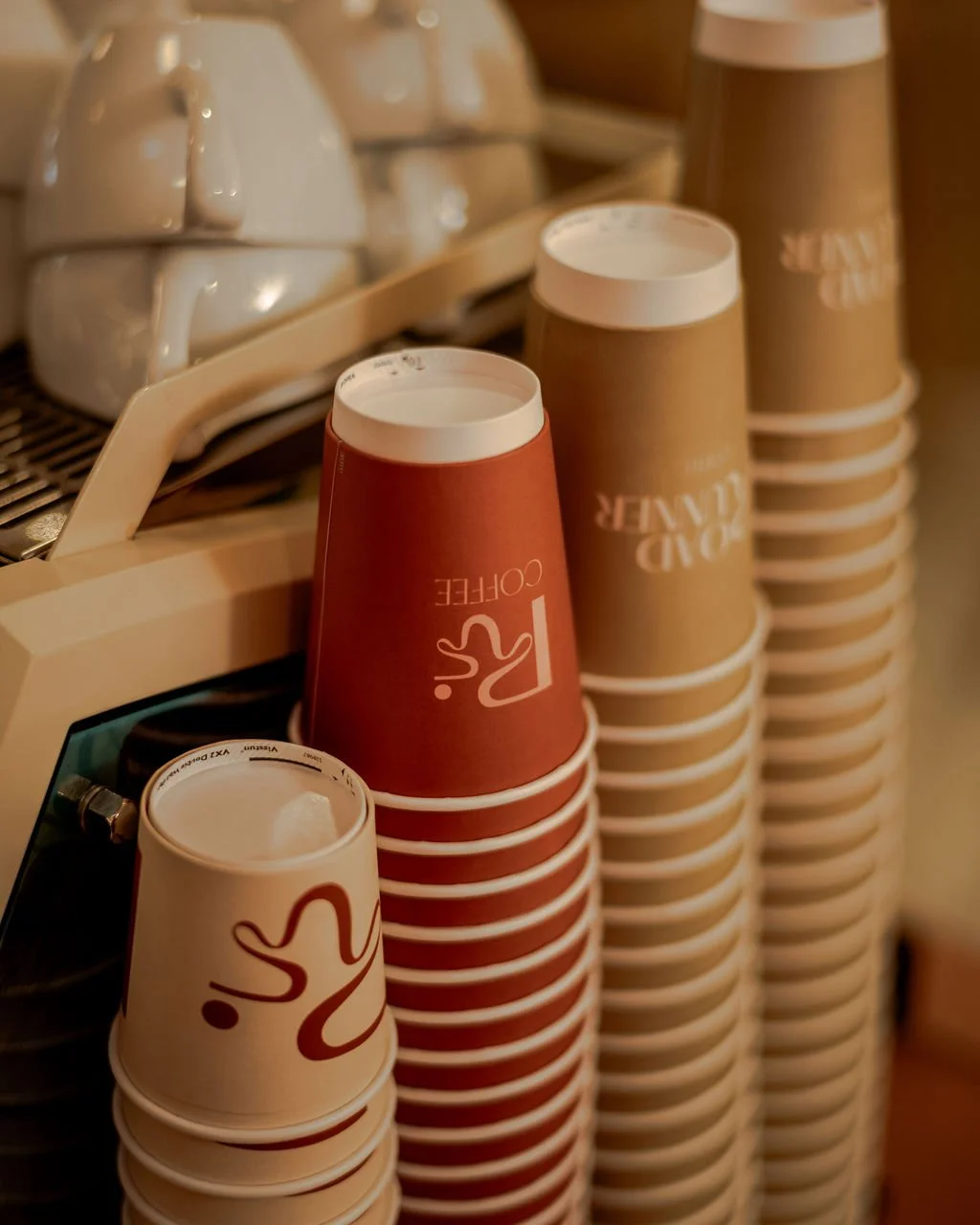 stacks of coffee cups with roadrunner logo