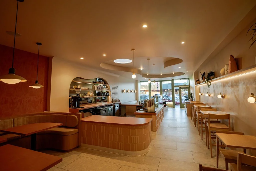 aesthetic coffee shop interior counter wall shelves and mirror