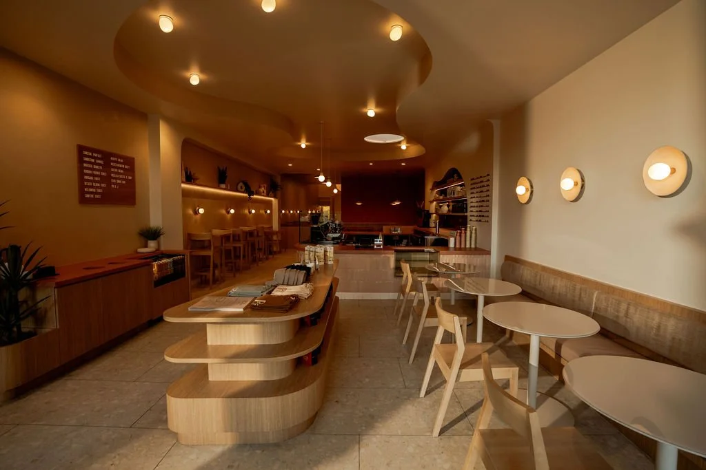 aesthetic coffee shop interior built in seating modern wall sconces
