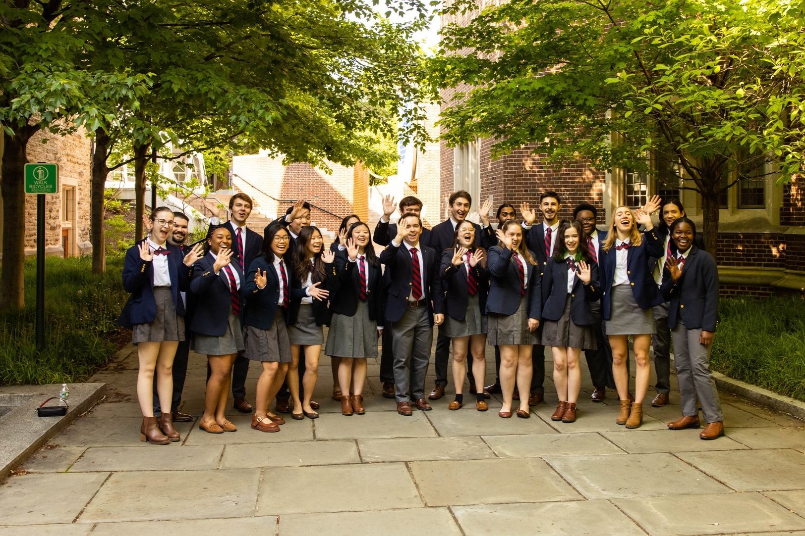 The Penn Glee Club waving during 2023's Alumni Weekend.