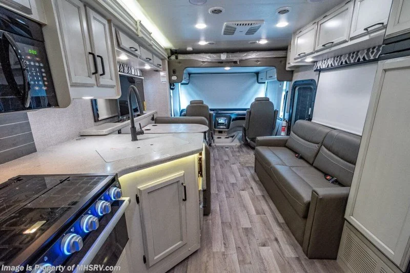 Living area with kitchen and jackknife sofa