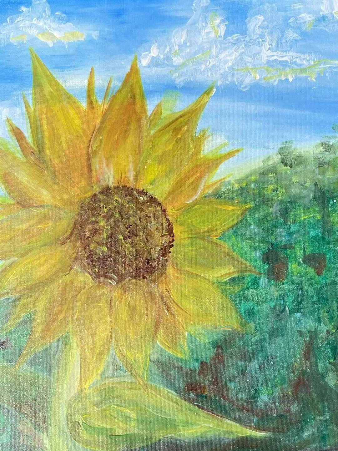 Painting of a sunflower in the first 2/3rds of the canvas. It's against a landscape background of greenery and blue cloudy skies.
